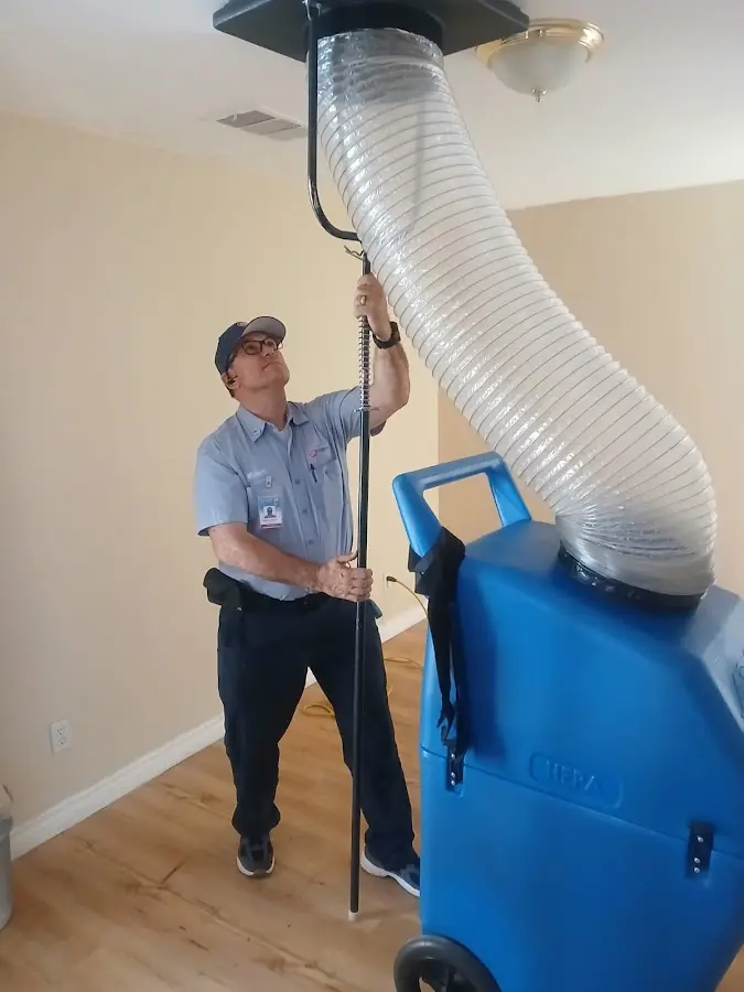 Furnace Tune-Up technician using HEPA equipment in Panama City Beach